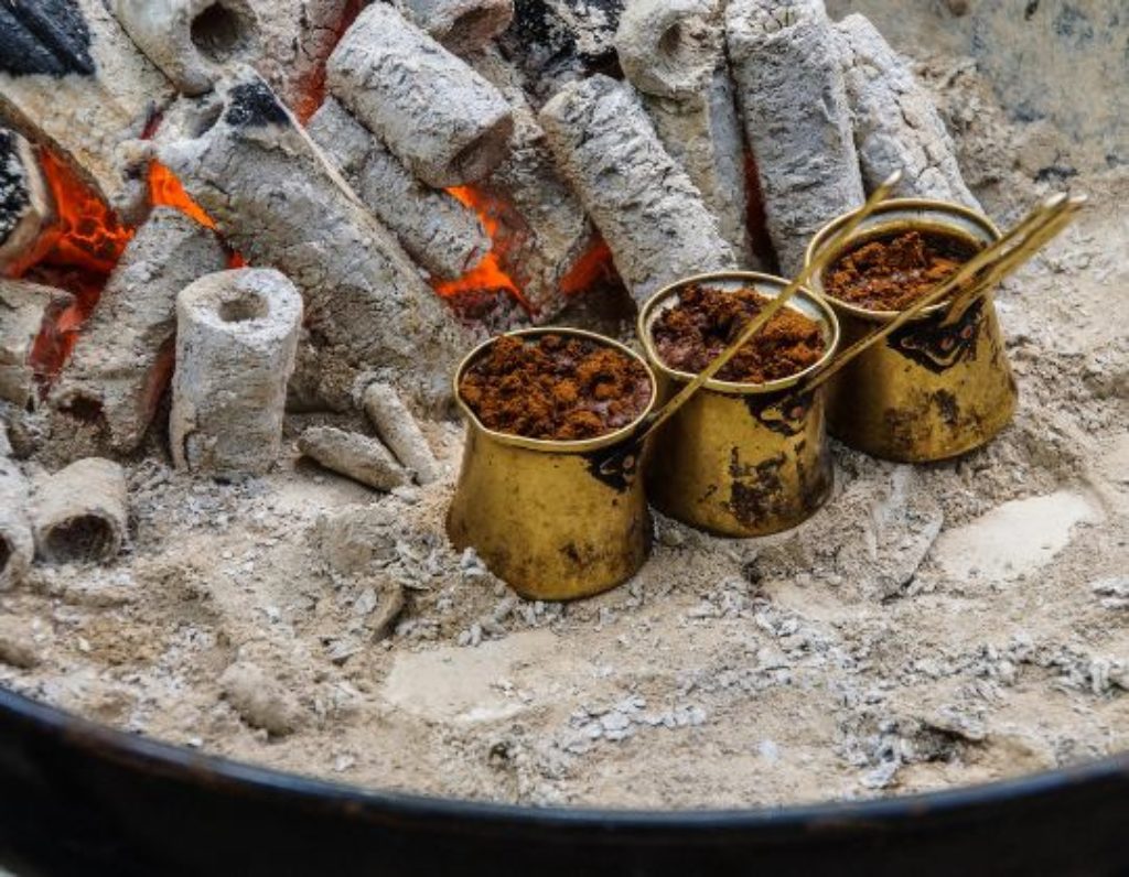 Turkish Sand Coffee Brewing with three brass pots