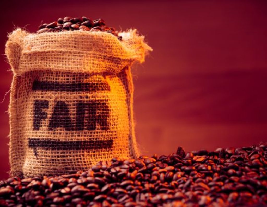 A bag of fair trade coffee in warm lighting