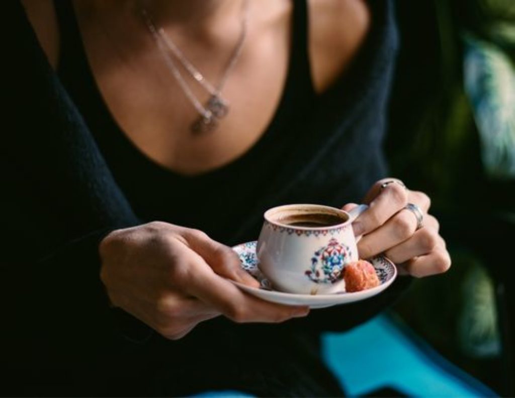 A lady enjoying a cup of Turkish coffee