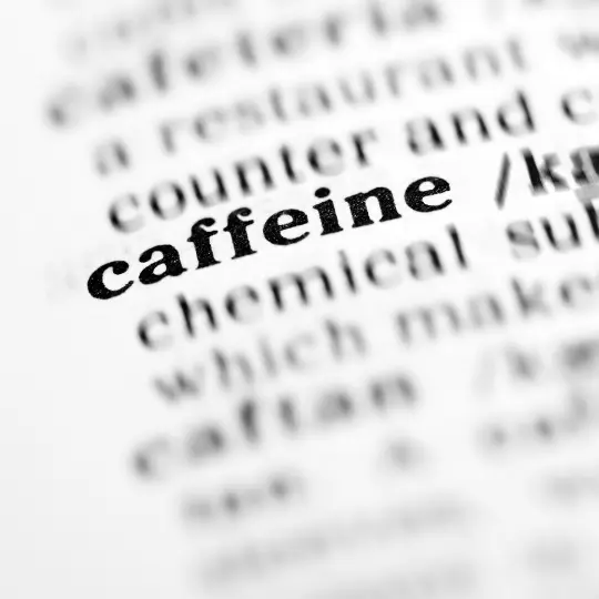The word caffeine in text with a blurry surrounding