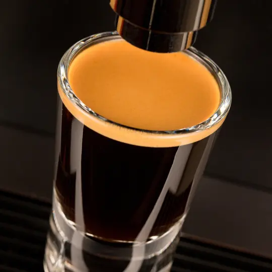 a doppio coffee perfectly brewed in a espresso glass